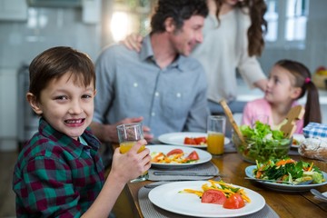Happy family having breakfast