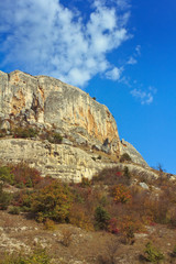 Mountain, a rock against the blue sky.