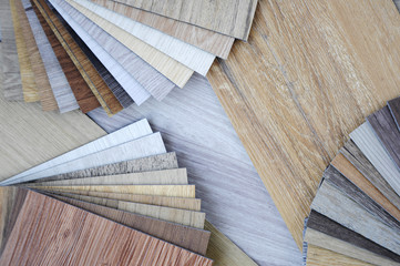 Laminate Wood Concept - Samples of laminate and vinyl and veneer texture on wooden Backg
