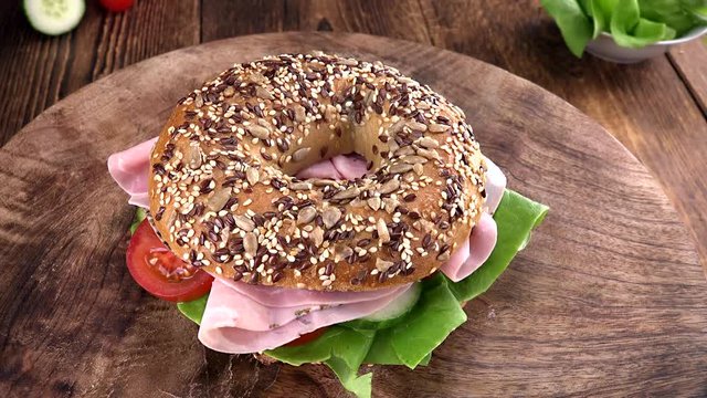 Portion of rotating Bagel with Ham (seamless loopable) as 4K UHD footage