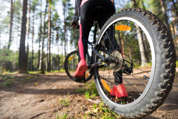 Fototapeta premium Woman riding a mountain bicycle