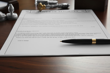 Pen and document on notary public table