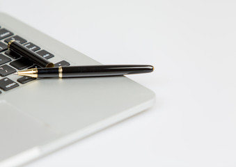 open pen on laptop closeup