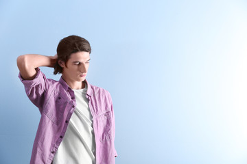 Handsome young man on blue background