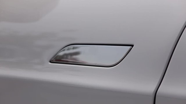 CLOSE UP: Tesla ecological electric car door opening system and handle closing