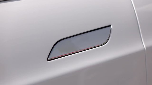 CLOSE UP: Tesla autonomous electric car door opening system and handle closing