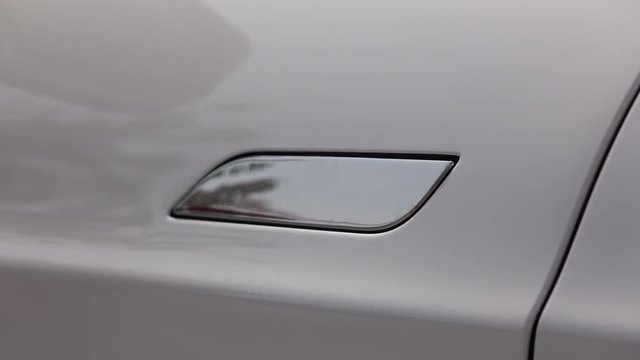 CLOSE UP: Tesla automatic electric car door opening system and handle vanishing