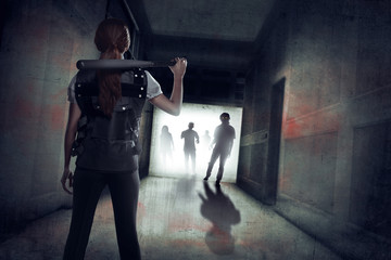 Young asian girl holding baseball bat on her shoulder against zombie