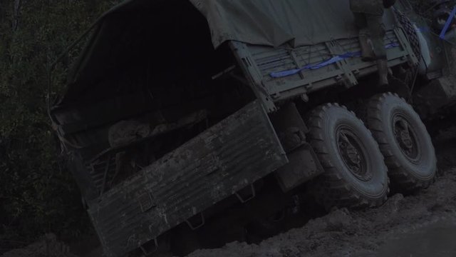 Military truck stands in the mud. Dirty trucks.