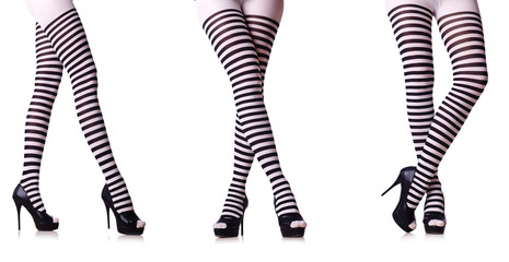 Legs with striped stockings isolated on white