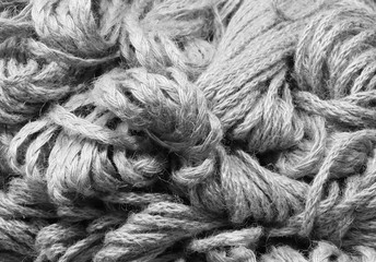 background of many skeins of raw strings for sale