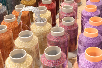 spools of thread with rhinestones on sale in English haberdasher