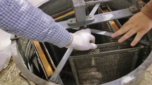 Honey extractor with honeycomb wax with honey frame.