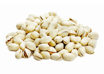 Dry salted pistachios isolated on white background.