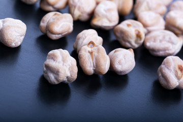 Dry chickpeas on dark background