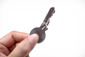 Closeup of hand holding a broken key isolated / Success and failure concept