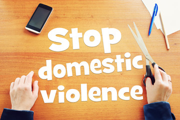 Woman claims to stop domestic violence. Conceptual image with scrapbooking