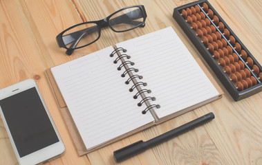 Spiral notebook on wood background