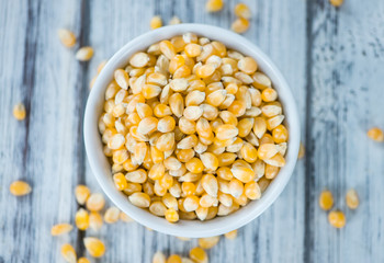 Wooden table with a portion of Corn