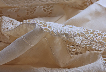 detail of a sheet decorated with lace and embroidery in Burano i