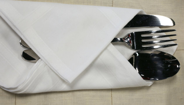 Knife fork and spoon on the table of the restaurant
