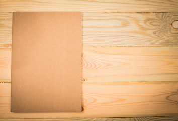 Naklejka na ściany i meble Close note book on wooden background
