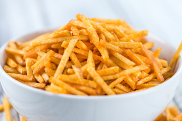 Bowl with Potato Sticks (close-up shot)