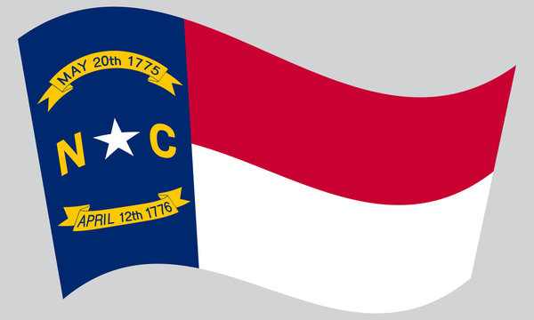 Flag of North Carolina waving on gray background