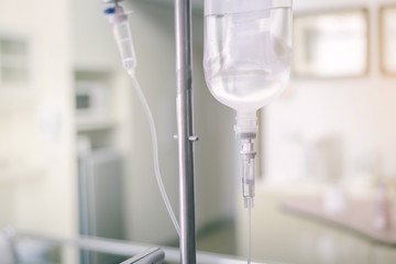 Close up IV saline solution drip for patient in hospital