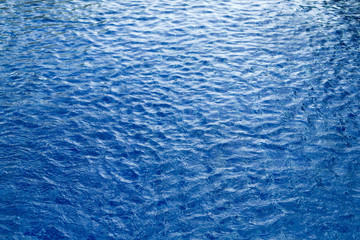 Surface waves are used for a dark blue background.