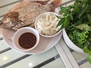 Tilapia grilled on white dish