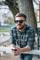 Fototapeta premium Man with gadget and glasses