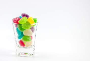 Colorful mix jelly fruits on white background