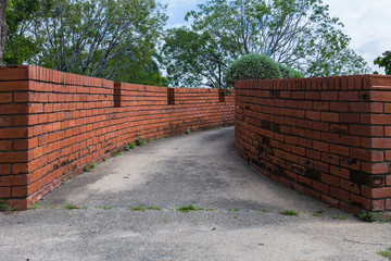 wall two side of narrow walkway between two buildings Two brick