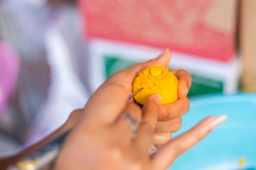 Woman's hand carved pumpkin flowers.