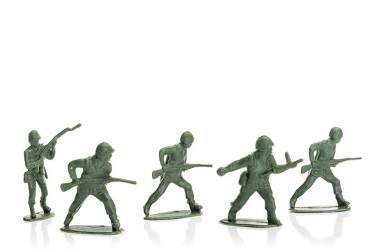 fighting toy soldiers isolated on white