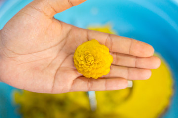 Woman's hand carved pumpkin flowers.