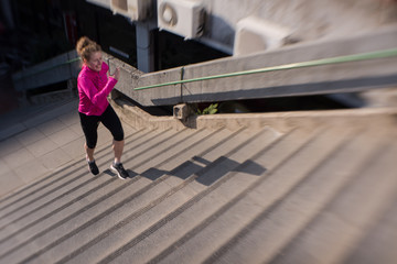 woman jogging on  steps