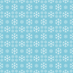 Christmas seamless pattern with snowflakes on a blue background.