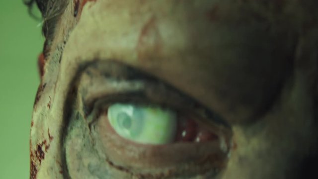 Closeup of Zombie Mans Eye on Green Screen