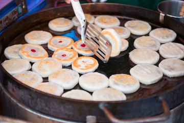 making chinese cake for sale in market