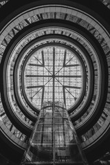 Double exposure photo of transparent circular glass ceiling 