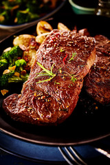 Close up on piece of marinated beef with herbs