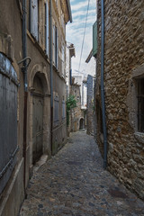 Narrow street in the small French village Vallon Pont d'Arc.