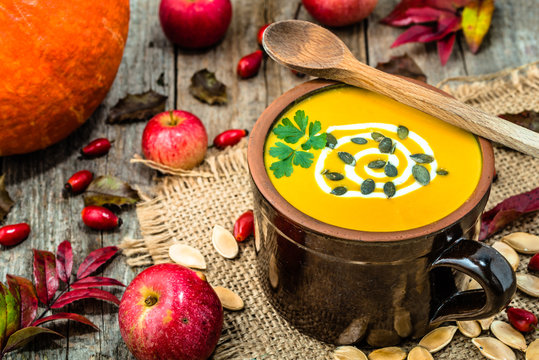 Pumpkin soup, seasonal autumn cooking concept