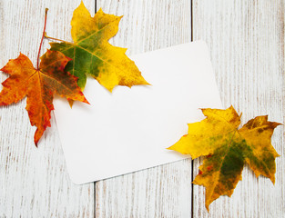 Colorful autumn leaves with card