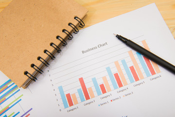 charts of growth on wood background , workplace businessman