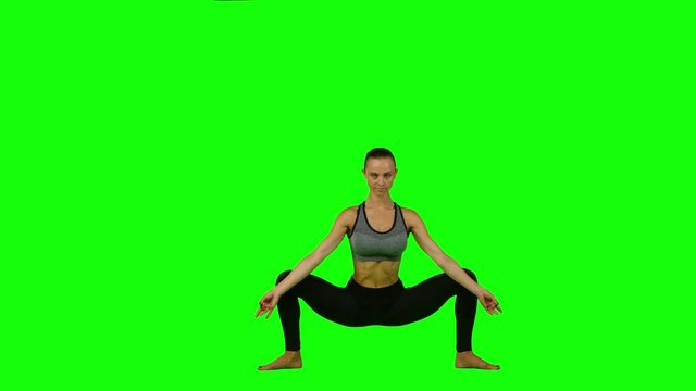 Female making yoga. Green screen