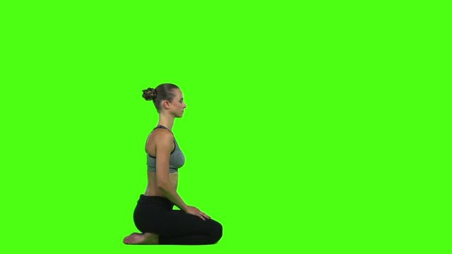 Sports women doing exercises yoga. Green screen. Slow motion