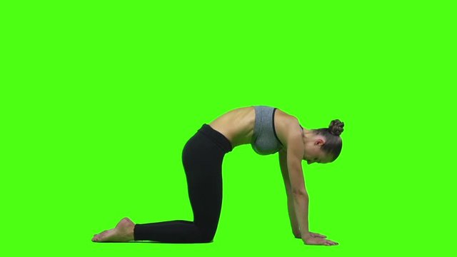 Woman doing yoga. Green screen. Slow motion